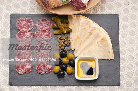 fresh cold cut platter with pita bread and pickles antipasti