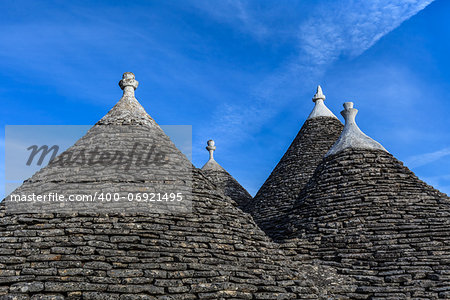 Roofs of the Trulli houses. Typical historical houses of Alberobello's town. Holiday destination in Apulia. Italy.