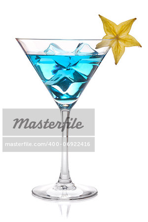 Blue cocktail with carambola in martini glass. Isolated on white