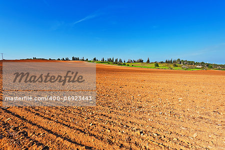 High-voltage Power Line Passes through the Plowed Fields in Israel