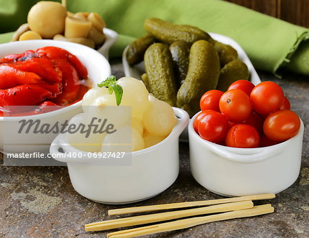 pickled snacks (tapas) - mushrooms, tomatoes, cucumbers and pearl onions