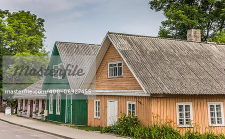 Traditional yellow and green wooden houses in Trakai, Lithuania