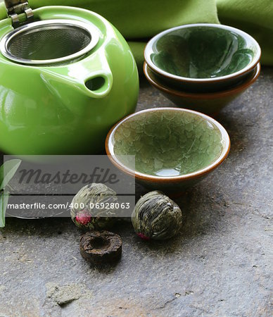 set for a traditional tea drinking (teapot, cups and green tea)