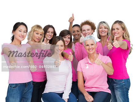 Voluntary women posing on white background and wearing pink for breast cancer