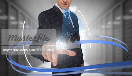 Businessman touching graph on futuristic interface with swirling lines in data center
