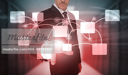 Businessman selecting futuristic flowchart interface in data center