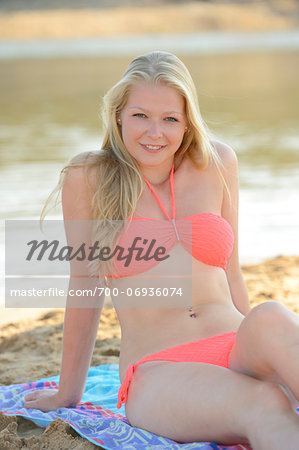 Portrait of Young Woman on Beach by Lake, Bavaria, Germany