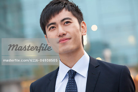 Close-up portrait of young businessman, China