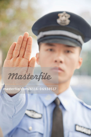 Police Officer Motioning to Stop