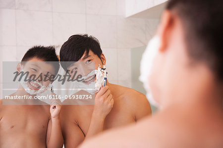 Father and Son Shaving Together