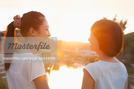 Two Young Women Looking at Sunset