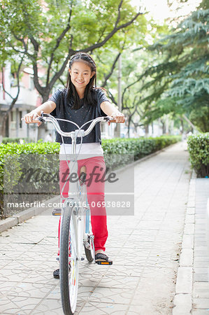 Young Girl Riding Her Bicycle