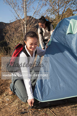 Women setting up the tent