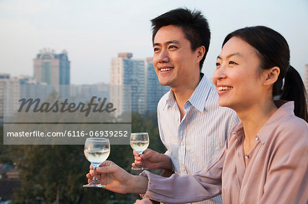 Couple Looking Out Over Cityscape