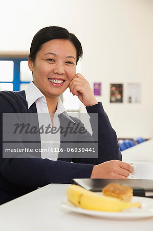 Young business woman in company cafeteria