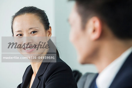 Businesswoman Looking At Colleague