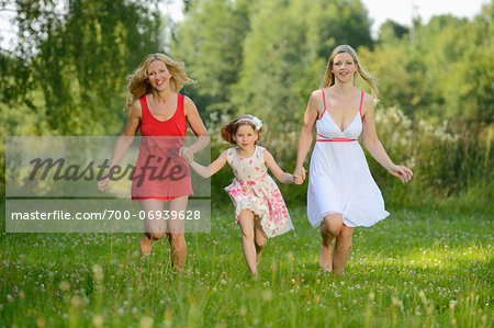 Woman with her daughter and her mother in summer, Bavaria, Germany.