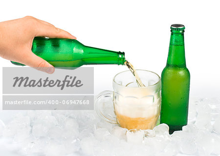 Green bottle of beer and beer mug. White isolated studio shot.