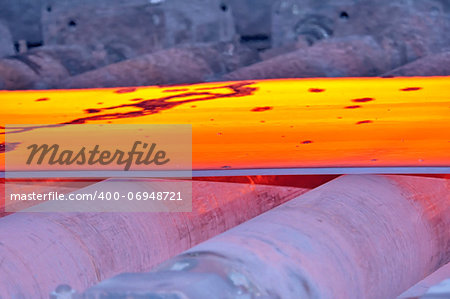 hot steel on conveyor, macro