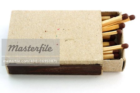 Wooden matches in an open old cardboard box