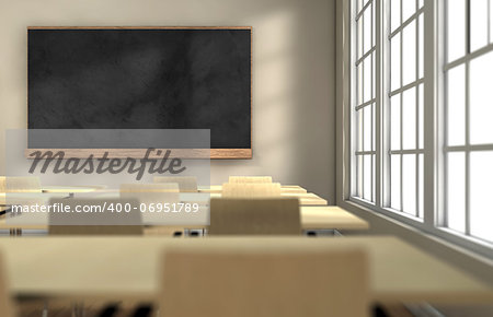 Classroom with desks and blackboard with focus on the blackboard