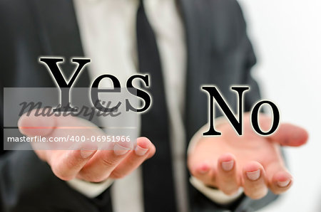 Hand of businessman weighing word Yes and No. Concept of decision making.