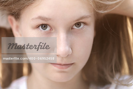 close up portrait of attractive teen girl in sunset, backlighted