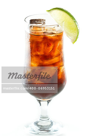 cuba libre, rum and cola cocktail served in a tall glass with a lime garnish