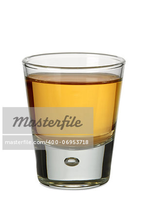 Photo of a shot glass filled with whiskey or bourbon.