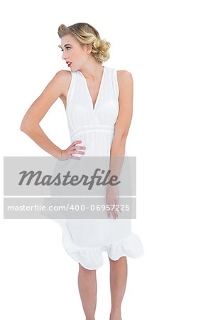 Thinking fashion blonde model posing looking away on white background