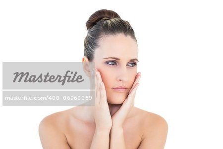 Peaceful woman looking away posing on white background