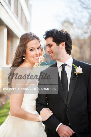 Close-up of Bride and Groom posing in City Park on Wedding Day, Toronto, Ontario, Canada