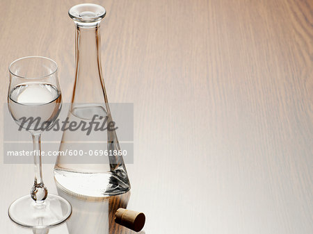 Glass of Grappa with Carafe and Cork, Studio Shot