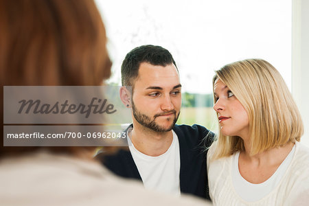Young Couple Talking to Consultant at Home, Mannheim, Baden-Wurttermberg, Germany