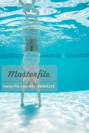 USA, Utah, Orem, Woman doing handstand under water