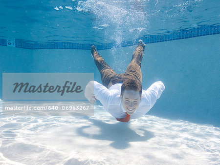 USA, Utah, Orem, Portrait of young groom under water