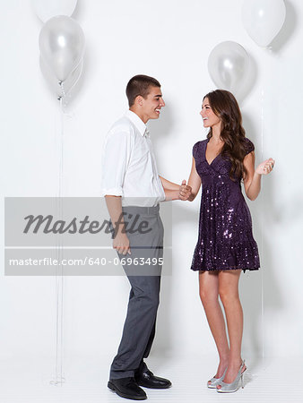 Young couple flirting at party