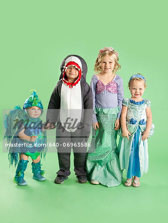 Portrait of children (12-17 months) and (2-7) in Mermaid and fish costumes for Halloween