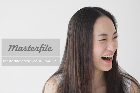 Young woman with long hair laughing