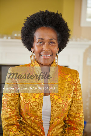 Portrait of elegant woman in gold jacket