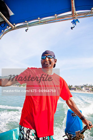 Man running fishing charter boat