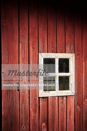 Close-up of window in wooden hut