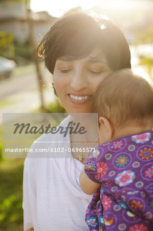 Smiling mother with baby