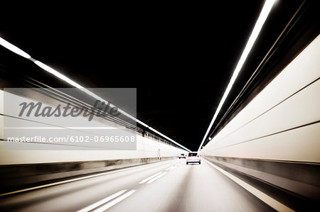 Cars driving through tunnel