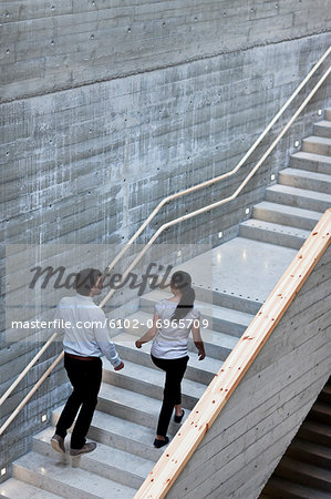 Man and woman walking on stairs