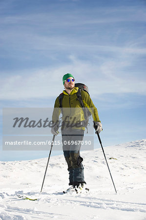 Male backcountry skier standing in the snow, Alpbachtal, Tyrol, Austria, Europe