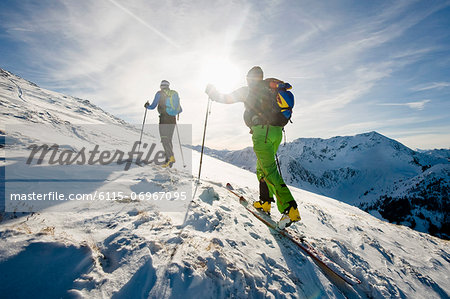 Backcountry skiers on the move, with back light, Alpbachtal, Tyrol, Austria, Europe