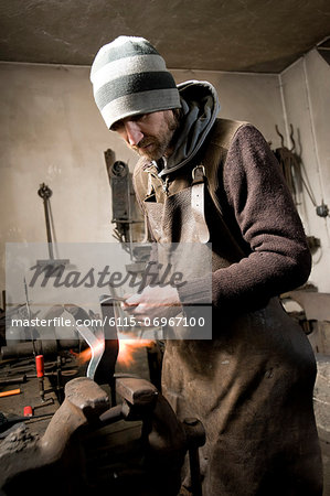 Blacksmith shaping iron, Landshut, Bavaria, Germany