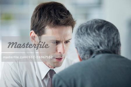 Businessmen discussing work