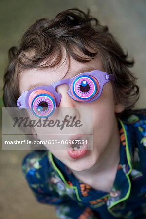 Boy wearing novelty glasses